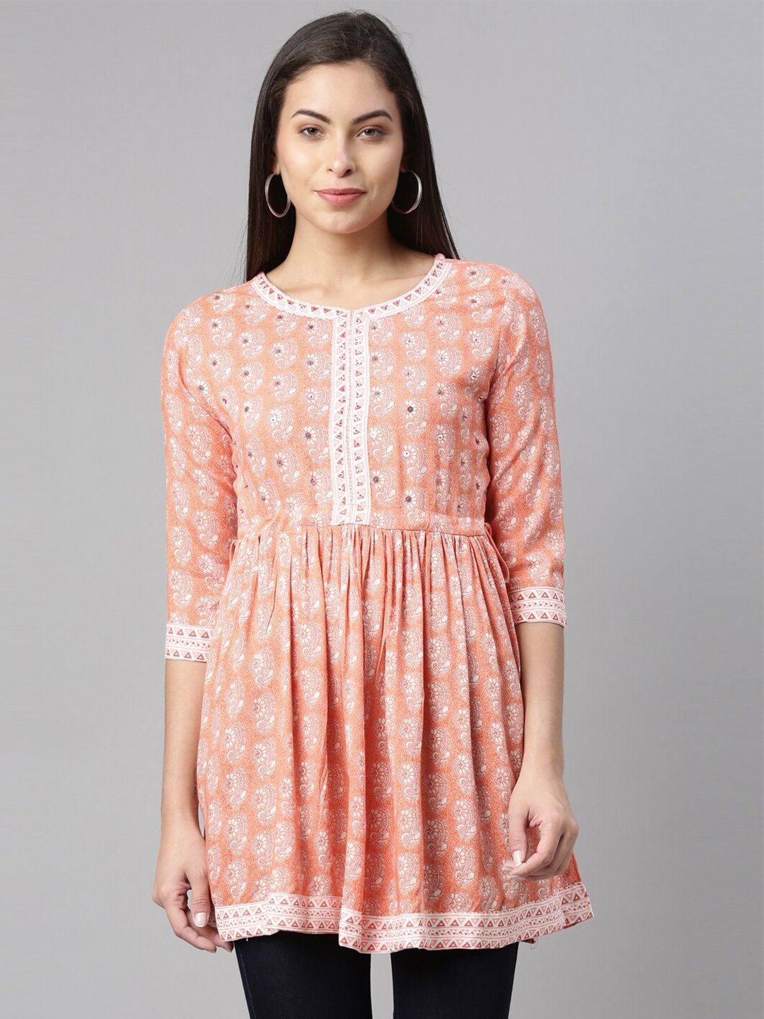 

Neerus Women Coral & White Floral Printed Sequinned Pleated Kurti