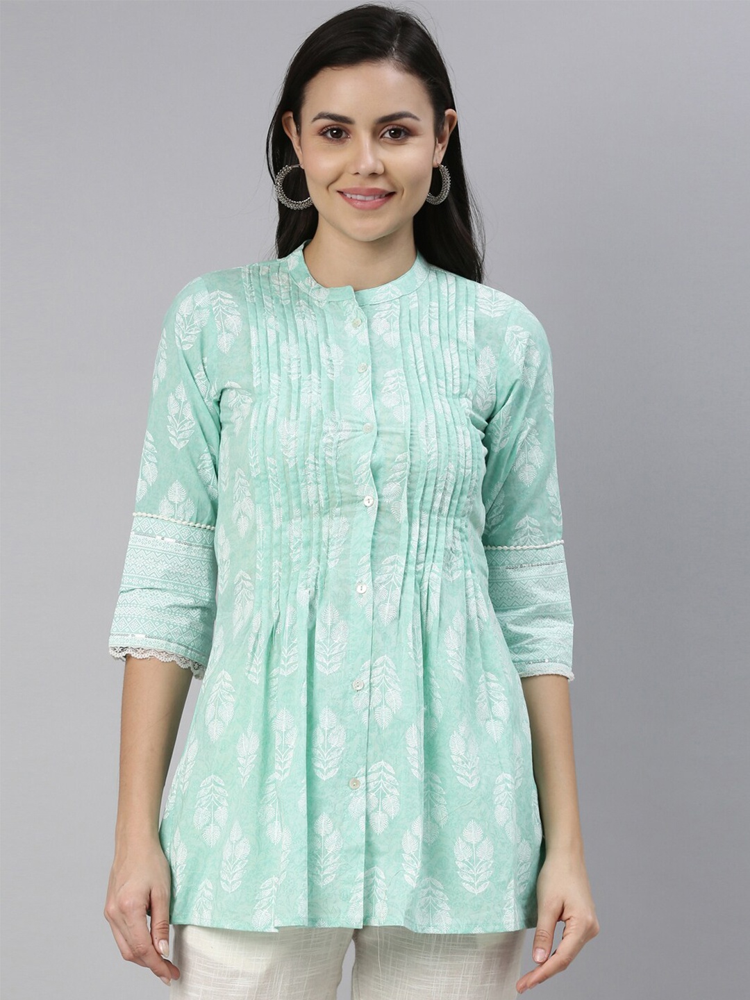 

Neerus Sea Green Floral Yoke Design Pure Cotton Pleated Kurti