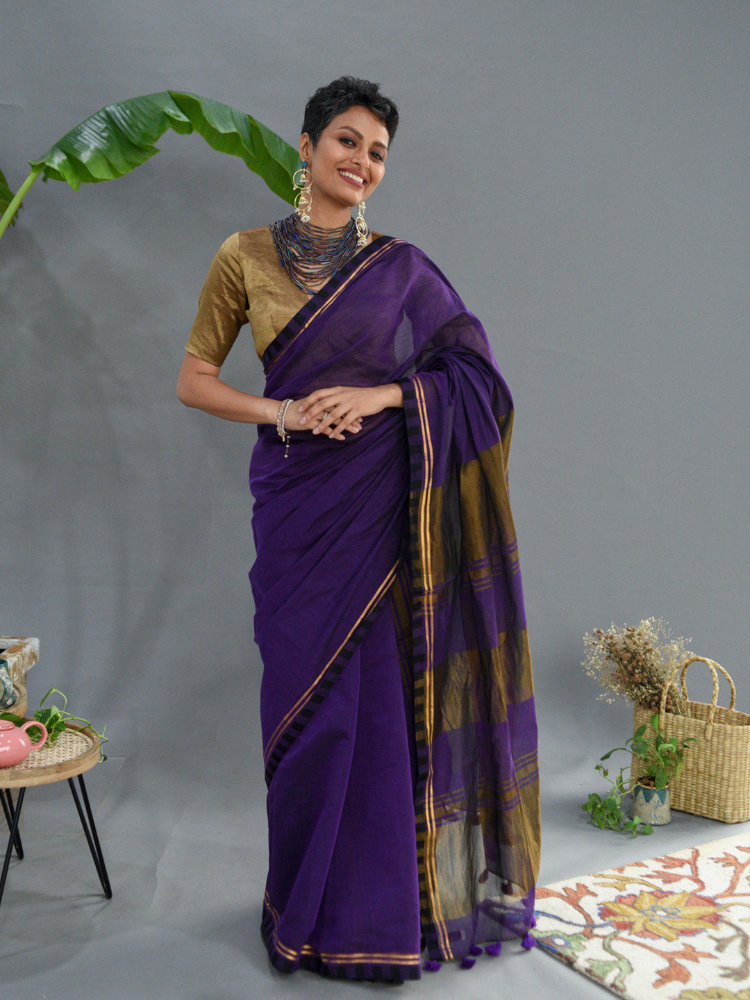 

Suta Purple & Gold-Toned Saree