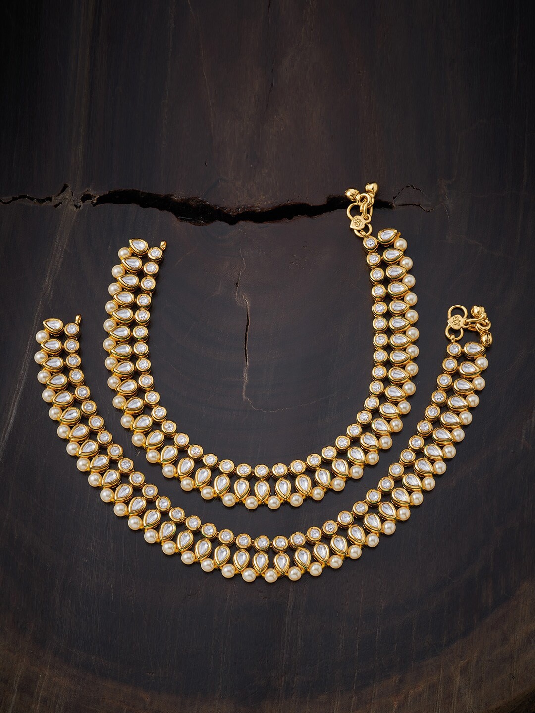 

Kushal's Fashion Jewellery Gold-Plated White Kundan Studded Anklets