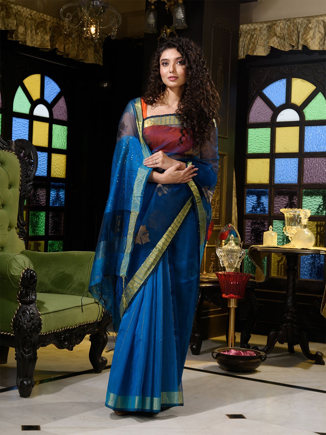 

Charukriti Teal Ethnic Motifs Sequinned Pure Silk Saree