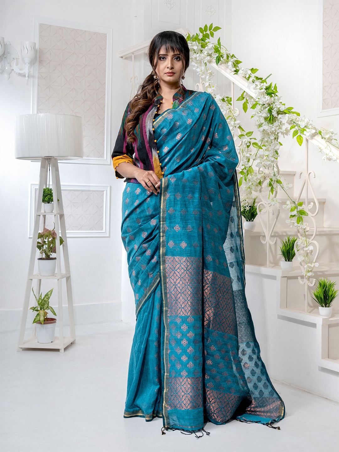 

Charukriti Teal & Copper-Toned Woven Design Zari Pure Linen Saree