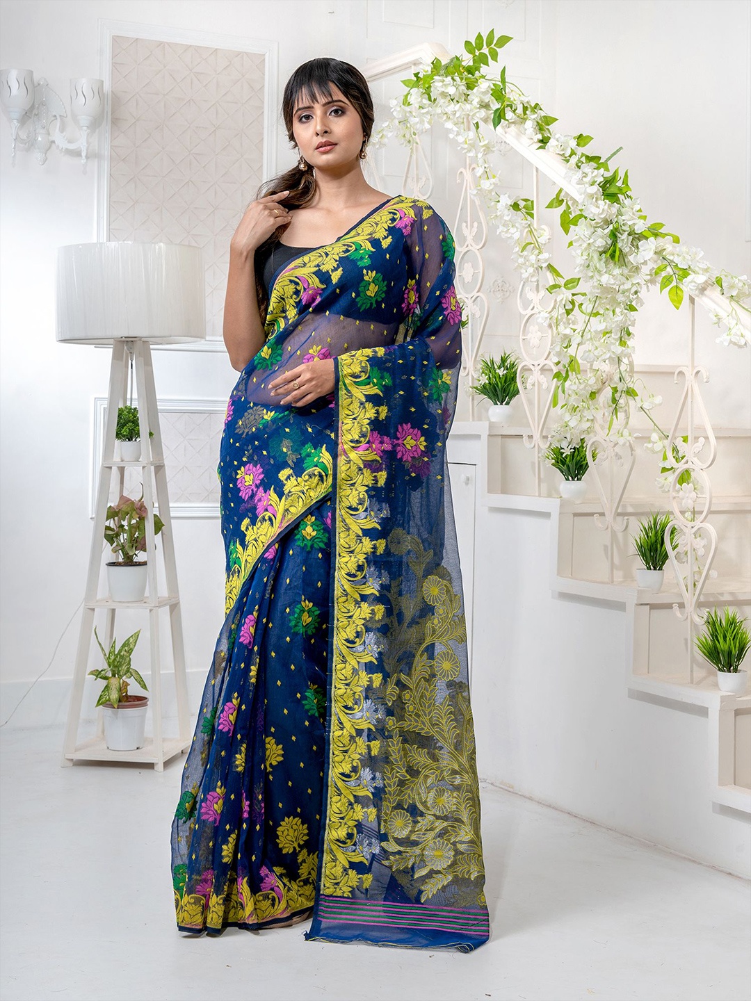 

Charukriti Blue & Yellow Floral Zari Silk Cotton Jamdani Saree