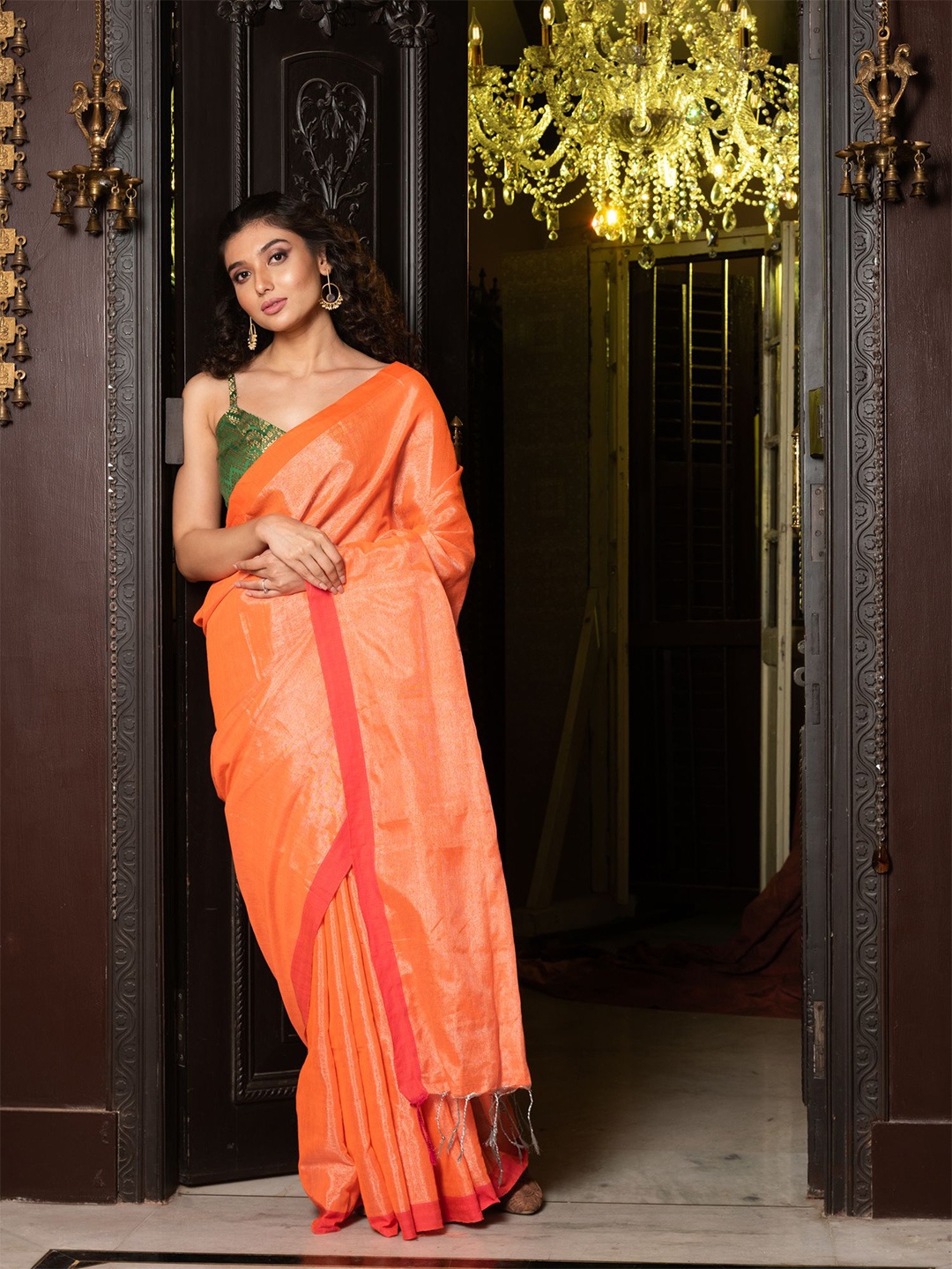 

Charukriti Orange & Green Tissue Saree