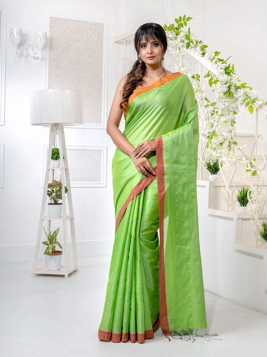 

Charukriti Green & Orange Woven Design Tissue Saree