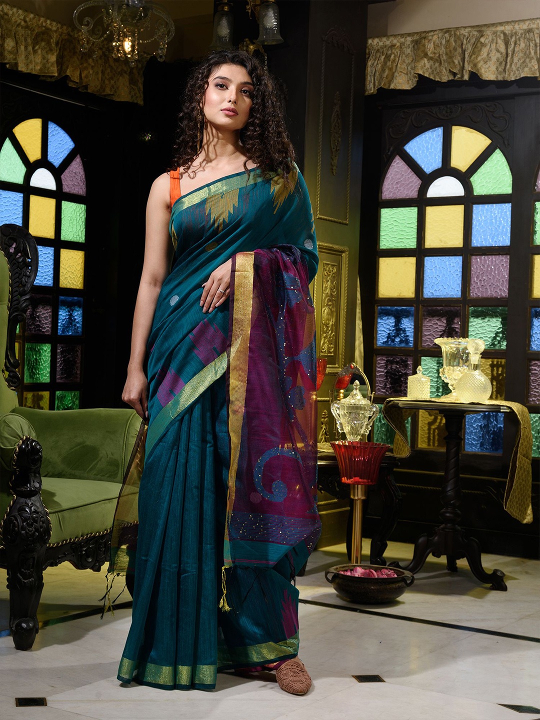 

Charukriti Teal Green & Purple Ethnic Motifs Handloom Zari Saree