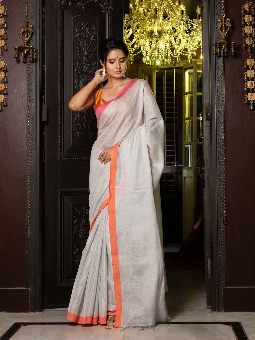 

Charukriti White & Orange Woven Design Tissue Saree