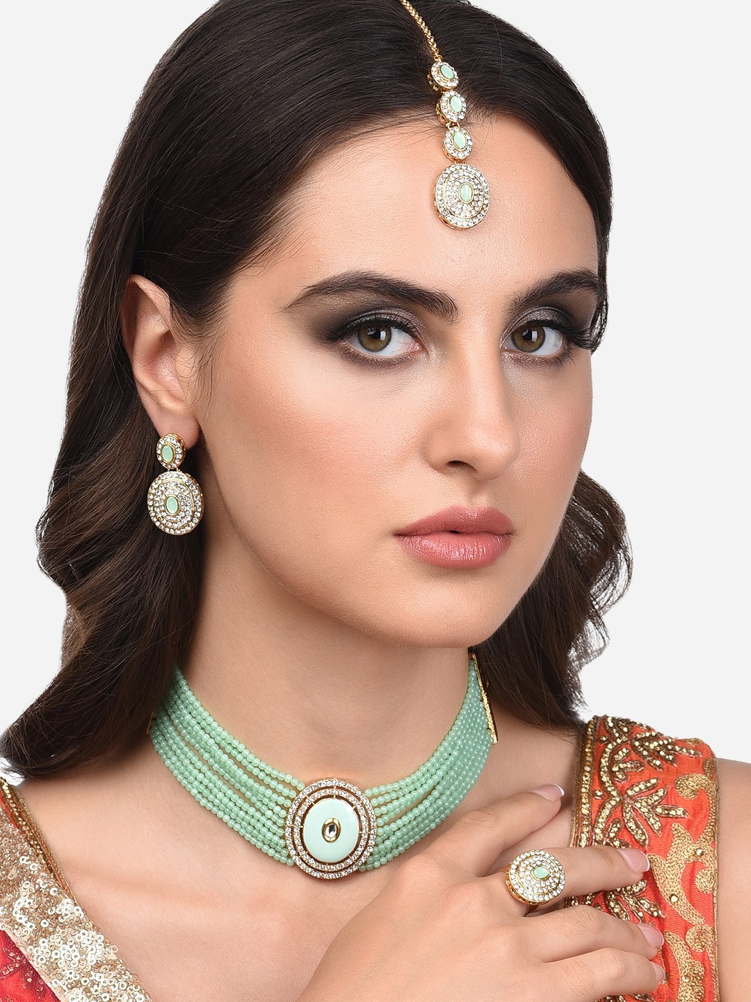 

Zaveri Pearls Gold-Plated Green Stone Studded & Beaded Jewellery Set