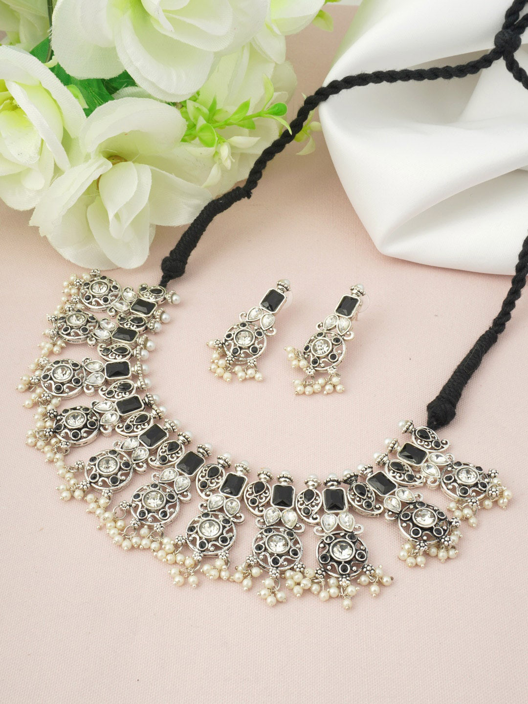 

Urmika Women Oxidized Silver-Plated Black Stone-Studded & Pearl Beaded Choker Jewellery Set