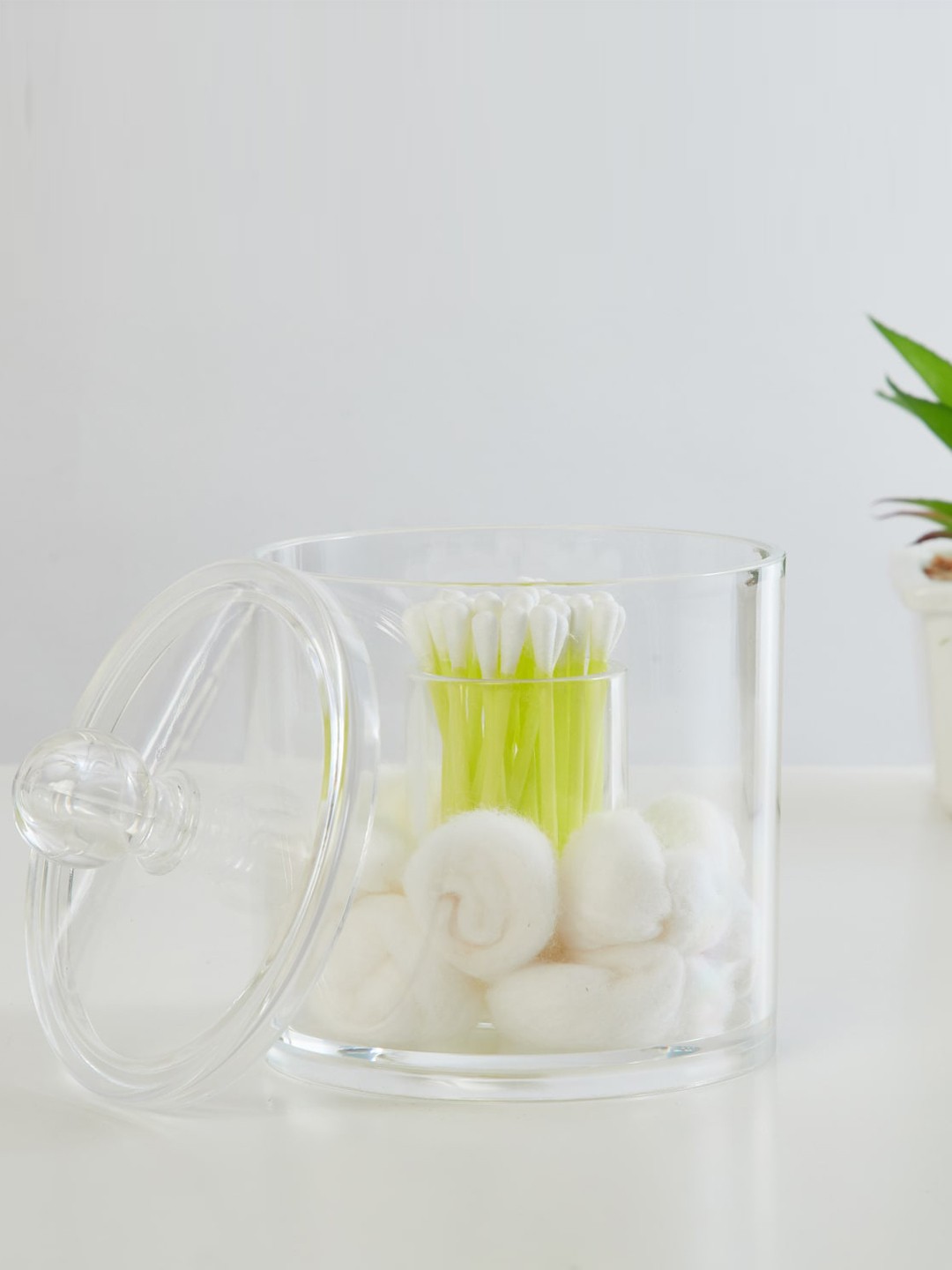 

Home Centre Transparent Round Cotton Canister