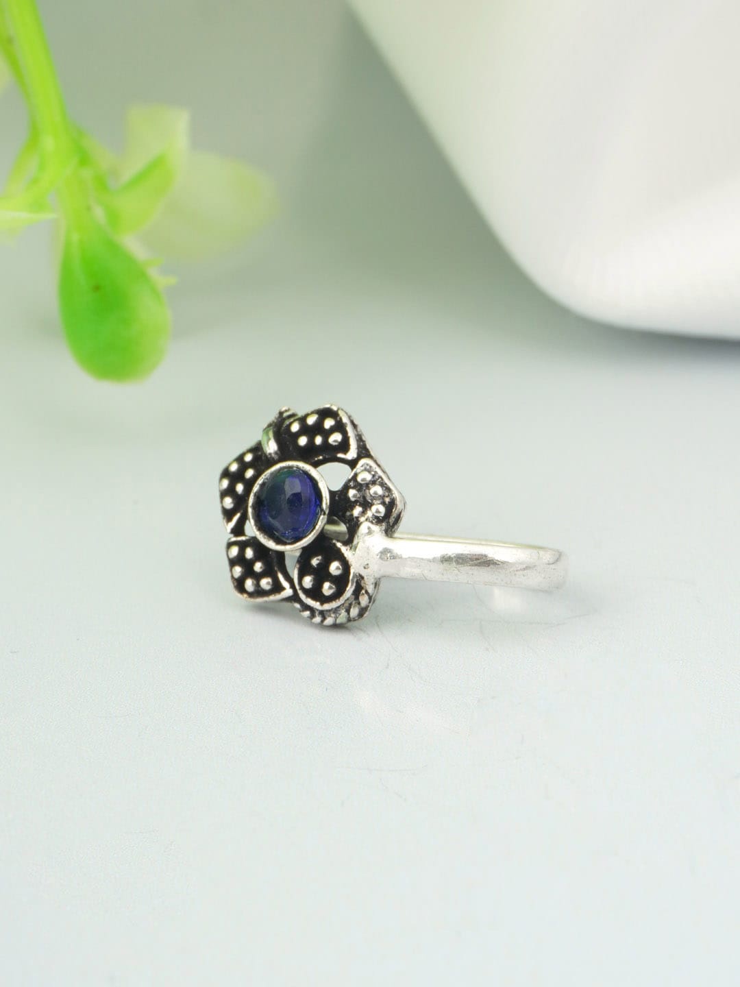 

Urmika Oxidized Silver-Toned & Blue Stone-Studded Nosepin