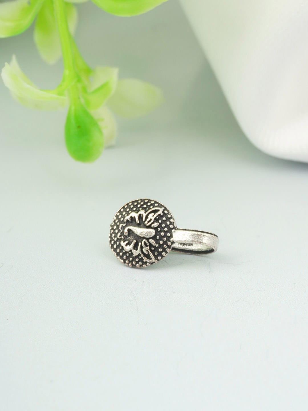 

Urmika Silver Toned Oxidised Ethnic Clip On Nose Ring
