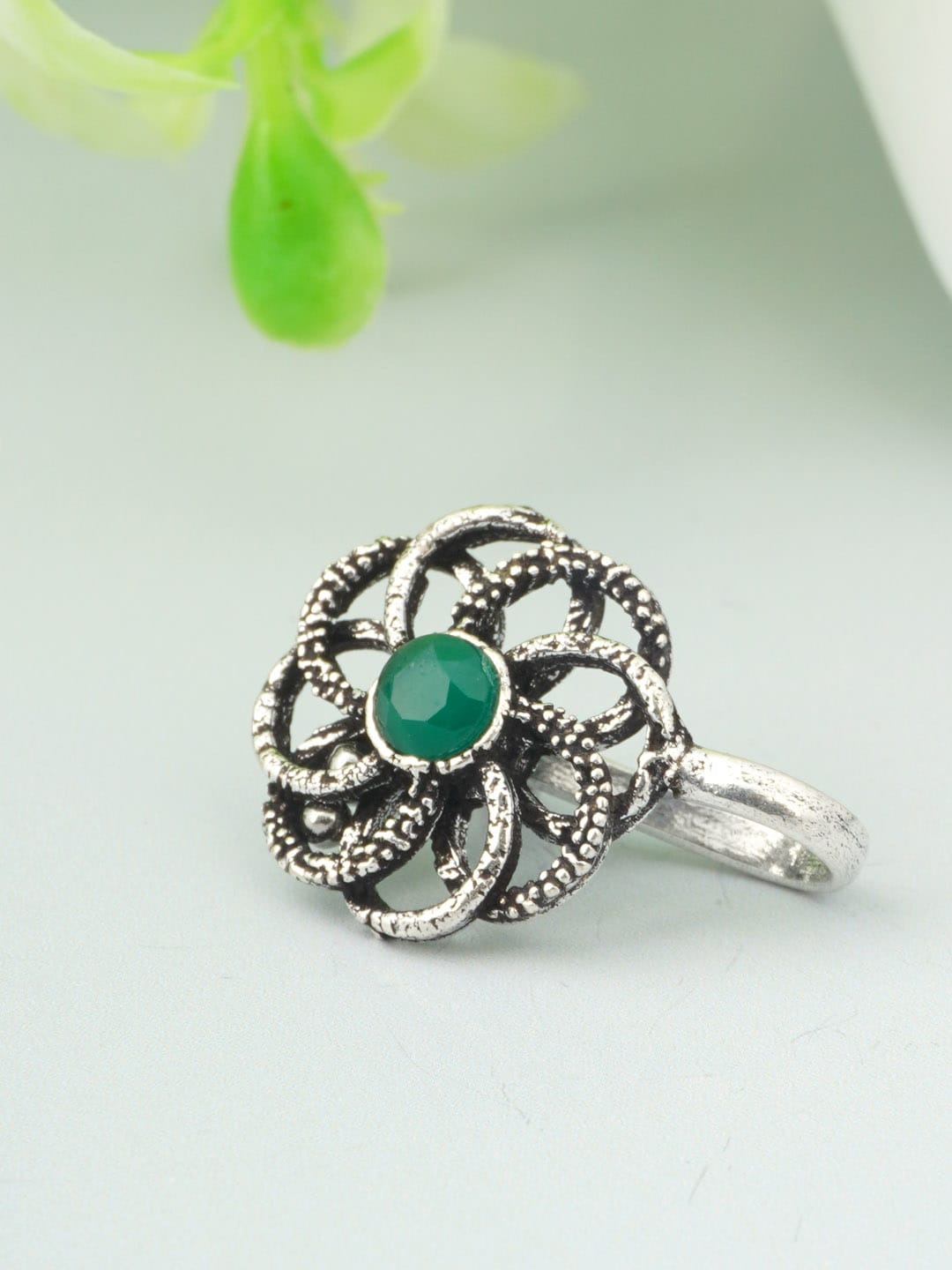 

Urmika Women Silver-Toned & Green Ethnic Oxidised Nosepin
