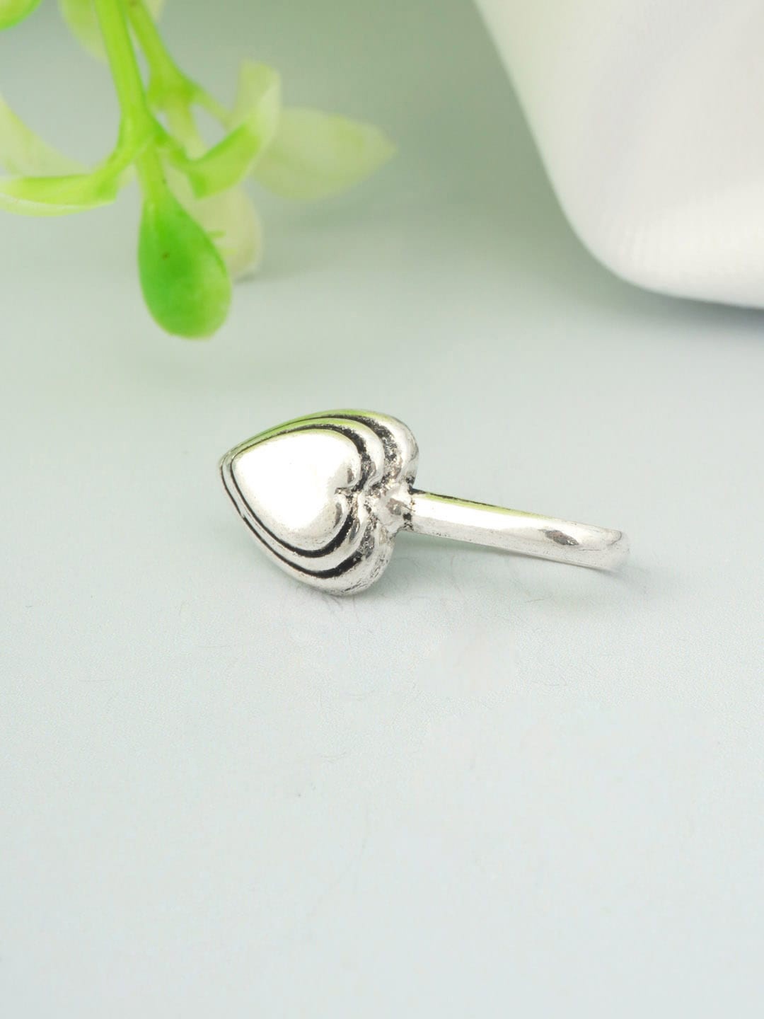 

Urmika Oxidised Silver-Toned Slip-On Nosepin