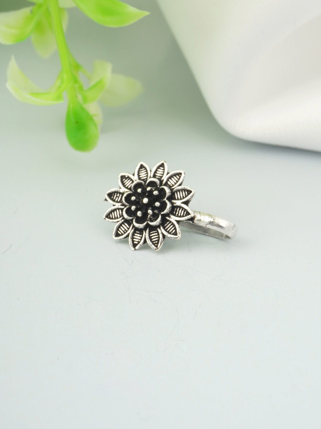 

Urmika Women Silver-Toned Ethnic Oxidised Nosepin
