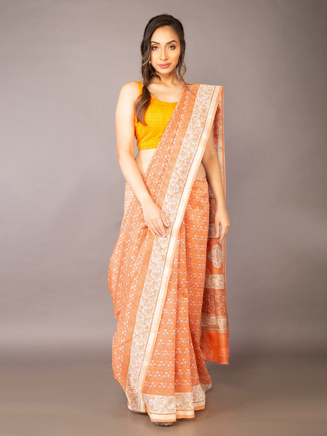 

Unnati Silks Women Orange Sarees