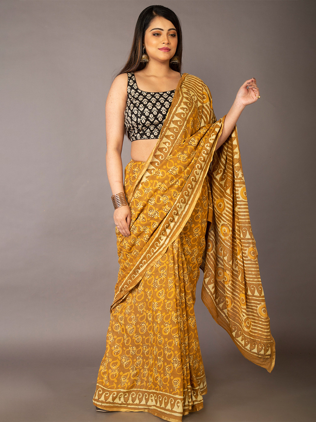 

Unnati Silks Women Mustard Sarees