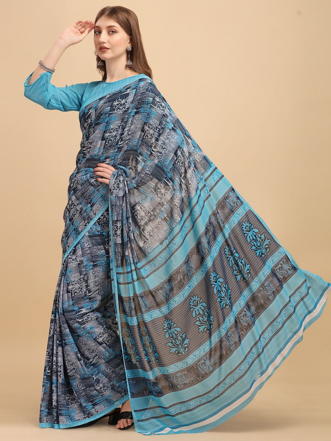 

Sangria Blue & Black Ethnic Motifs Saree