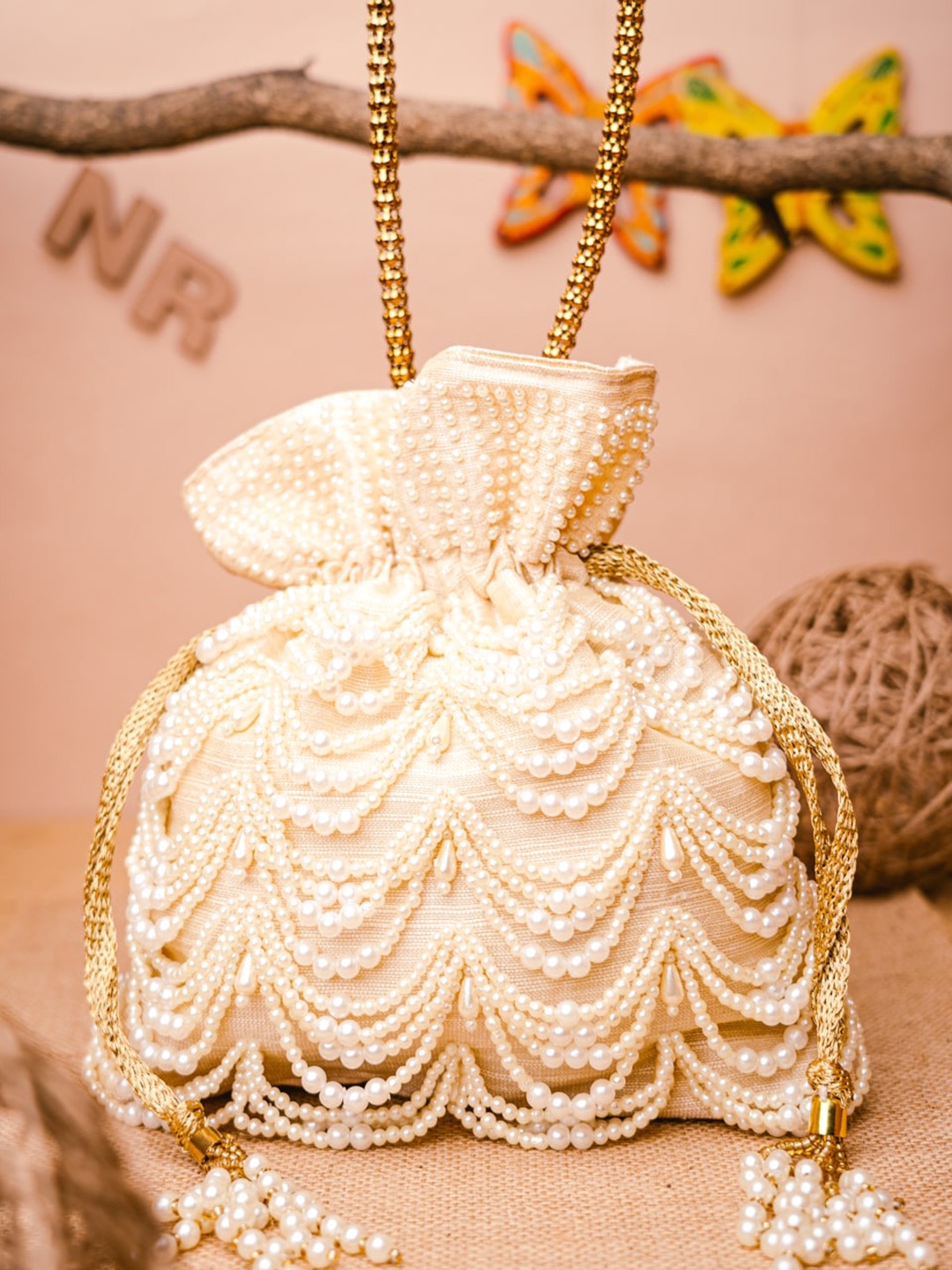 

NR By Nidhi Rathi Cream-Coloured Embellished Potli Clutch