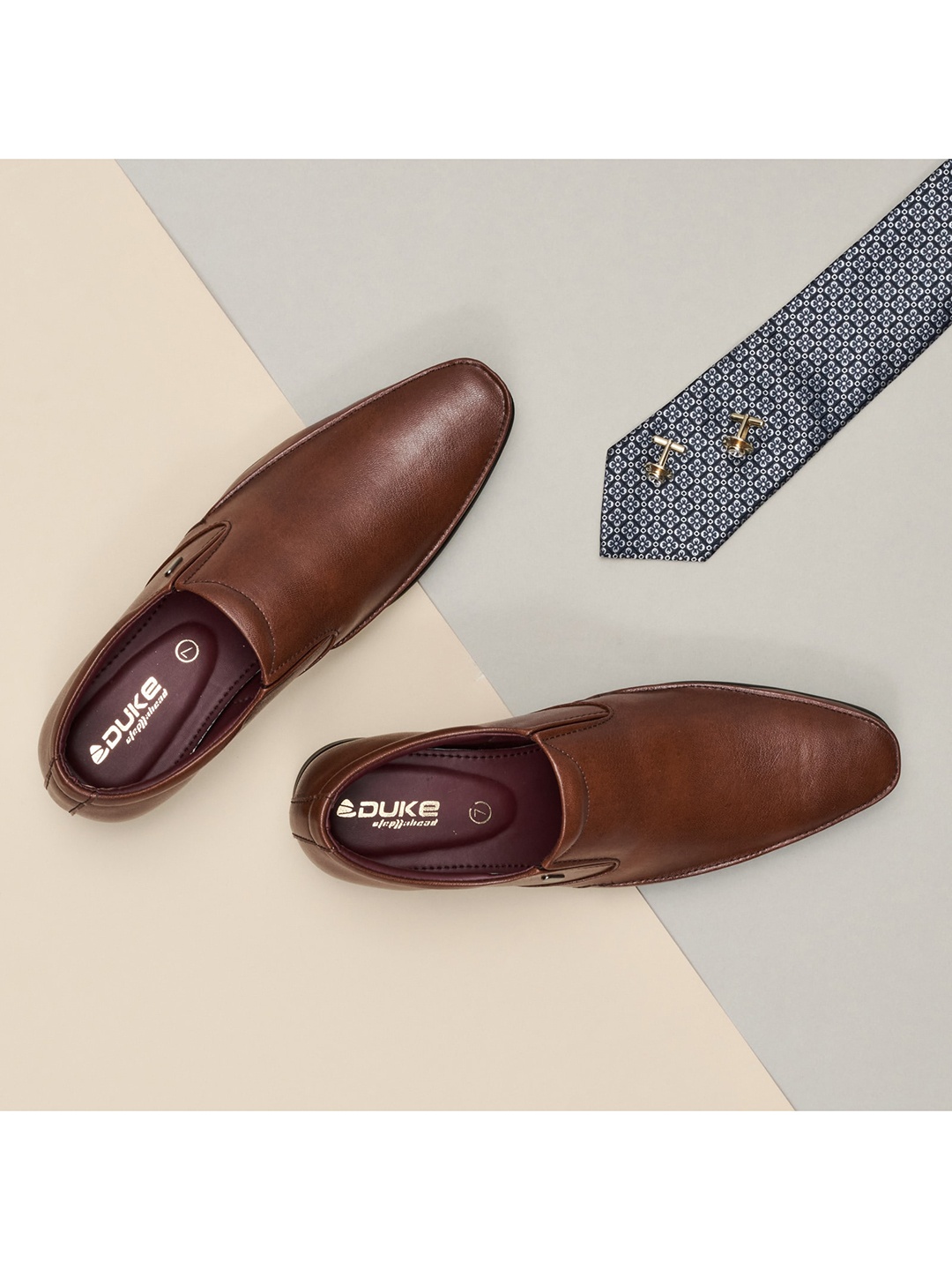 

Duke Men Tan Solid Formal Slip-On Shoes
