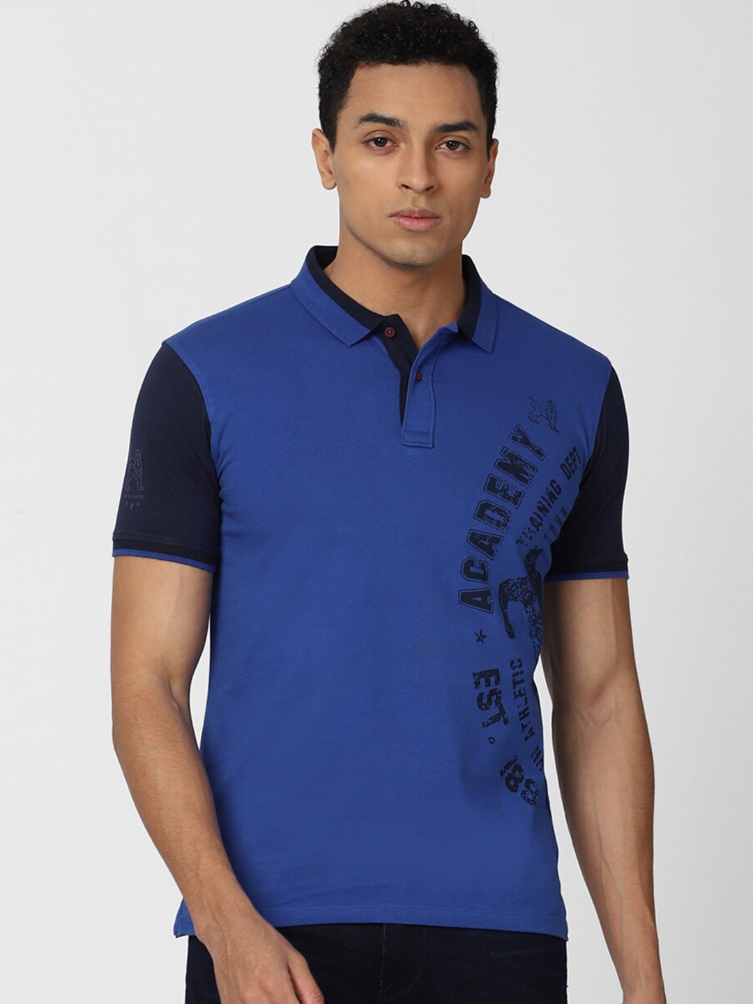 

Van Heusen ACADEMY Men Blue Typography Printed Polo Collar T-shirt