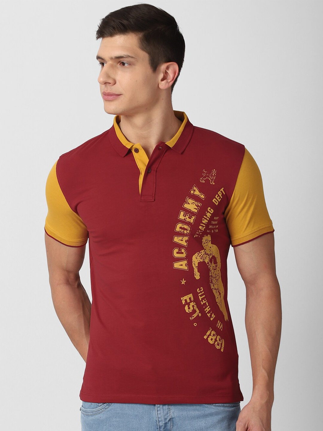 

Van Heusen ACADEMY Men Maroon & Yellow Typography Printed Pure Cotton Polo Collar T-shirt