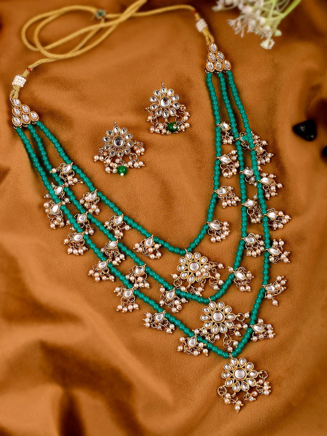 

Shoshaa Women Gold-Plated Green Artificial Stone Studded Layered Jewellery Set