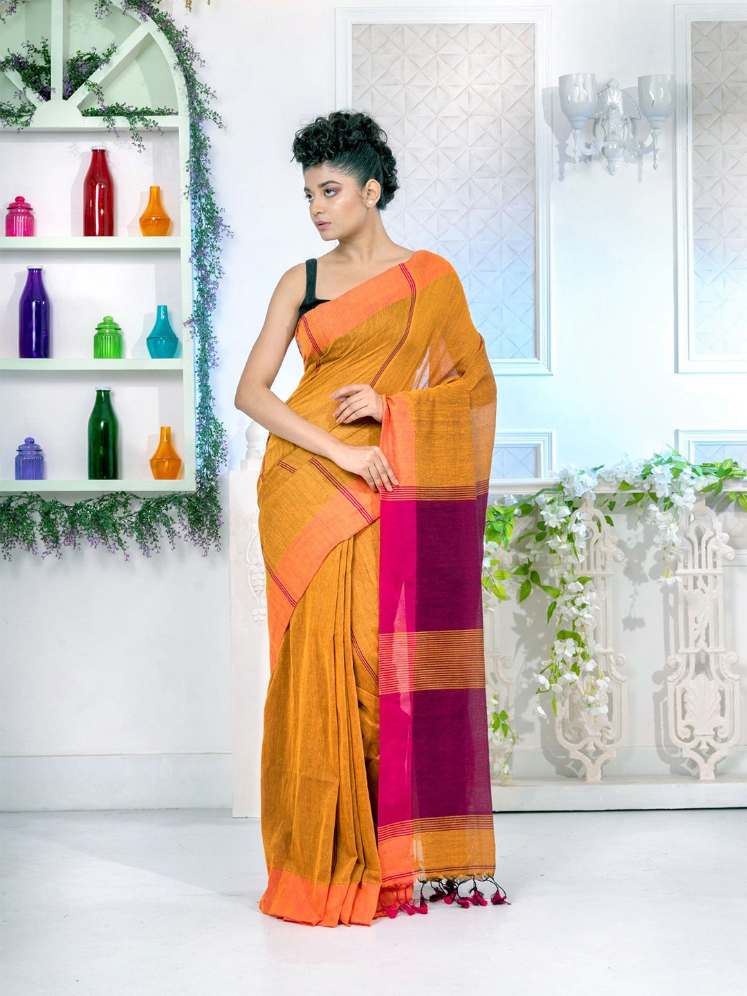 

Charukriti Women Mustard Sarees