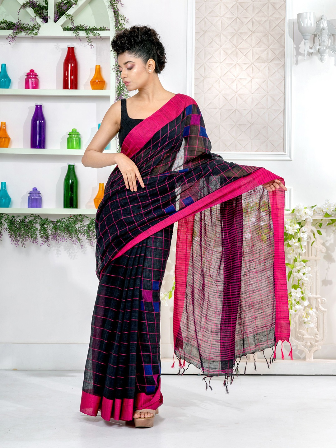 

Charukriti Women Black Sarees