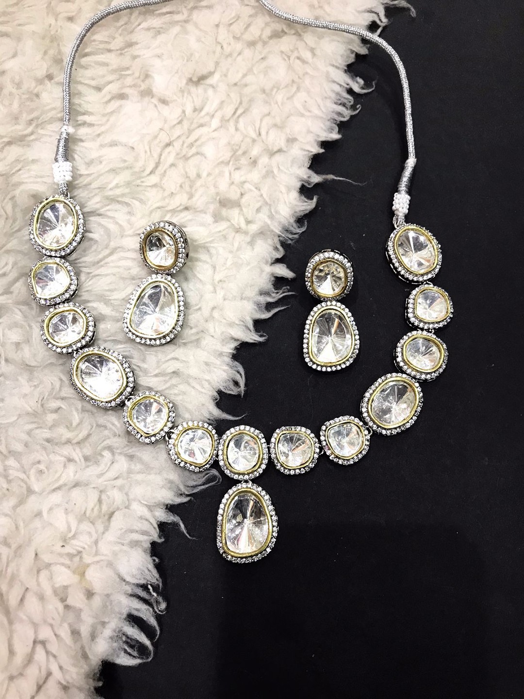 

SURYAM DESIGNER JEWELLERY Silver-Plated & White Kundan-Studded Jewellery Set