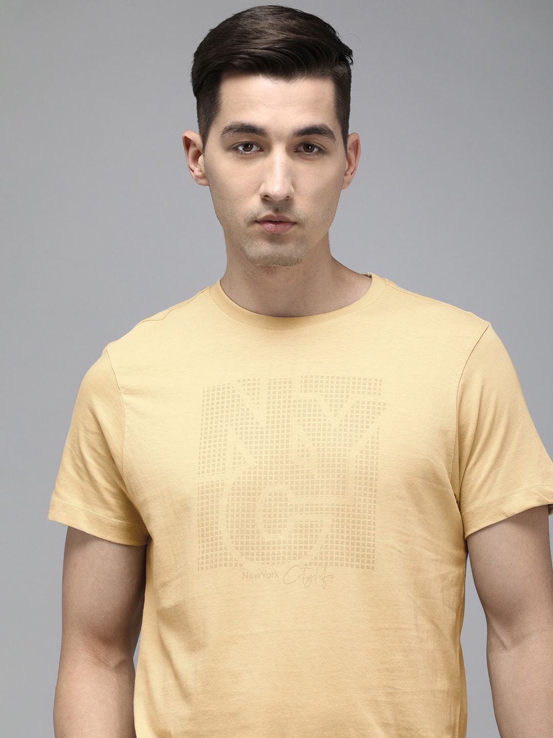 

Arrow New York Men Beige & Brown Typography Printed Cpact Cotton T-shirt