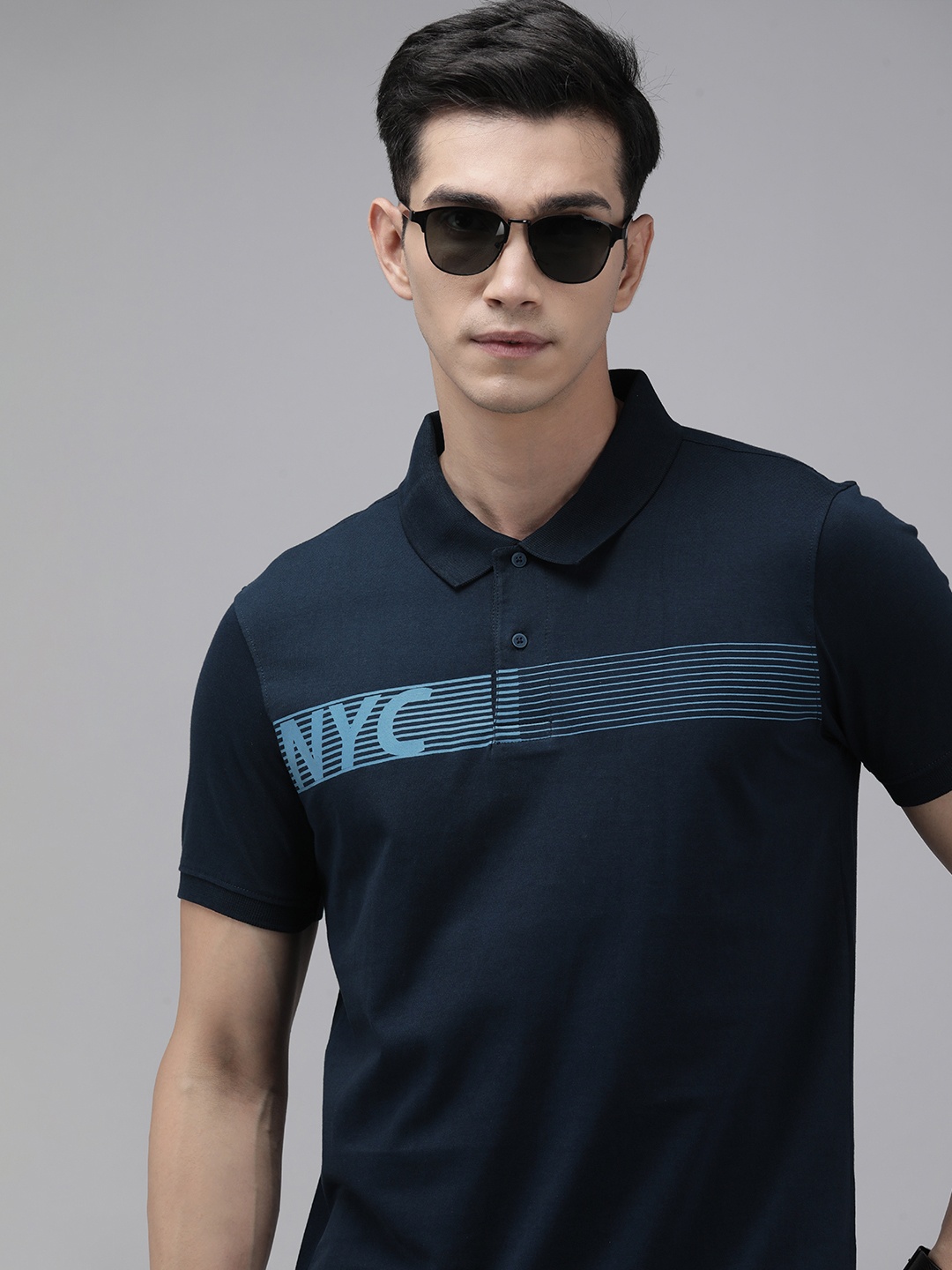 

Arrow New York Men Navy Blue & Blue Typography Printed Pure Cotton Polo Collar T-shirt