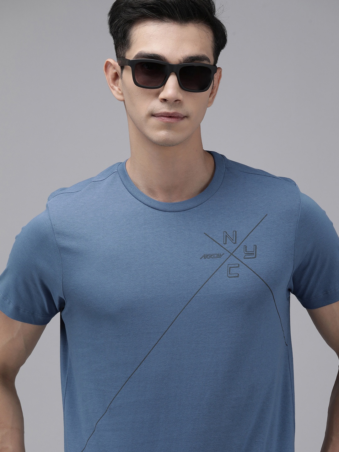 

Arrow New York Men Green & Black Brand Logo Printed Pure Cotton T-shirt