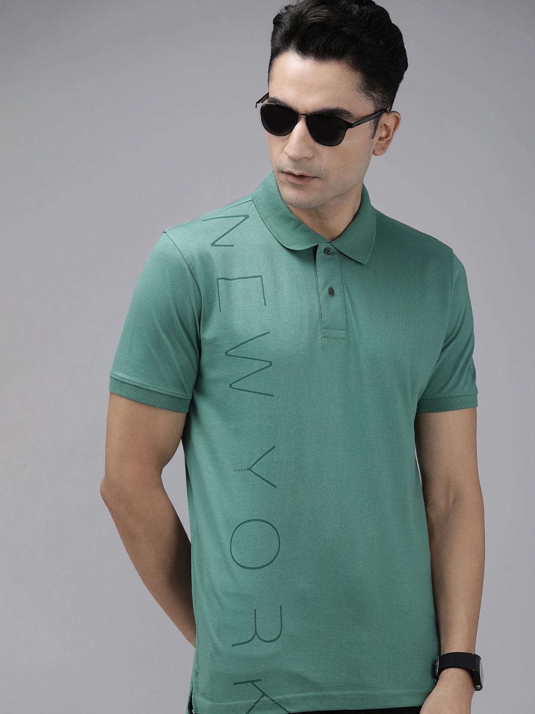 

Arrow New York Men Green Typography Printed Pure Cotton Polo Collar T-shirt