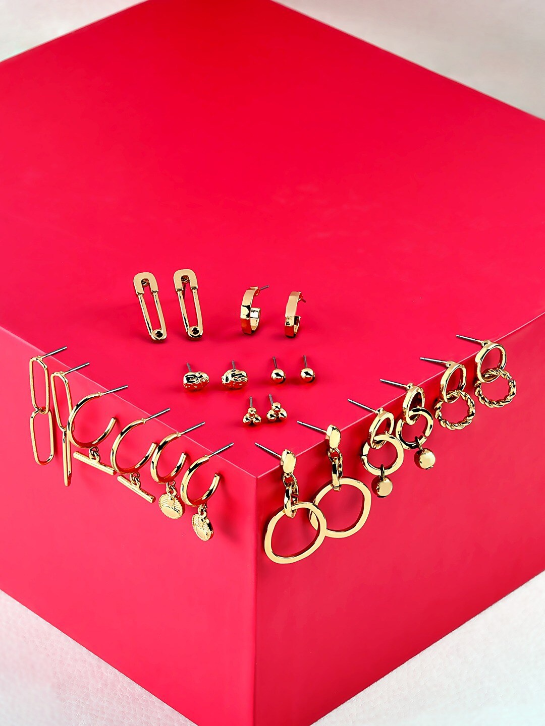 

AMI Set Of 11 Gold Tone Contemporary Studs, Dangle & Semi-Hoop Earrings