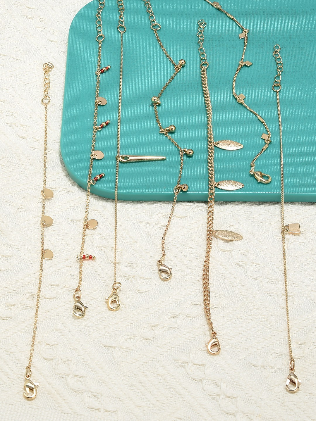 

AMI Women Set of 7 Gold Tone Charms Embellished Stackable Bracelets