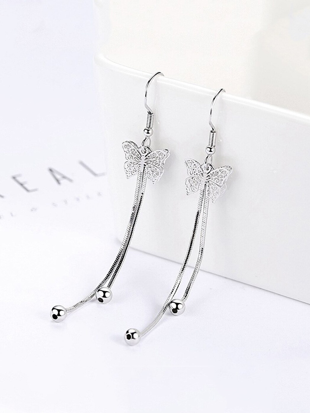 

Unwind by Yellow Chimes Silver-Toned Contemporary Drop Earrings