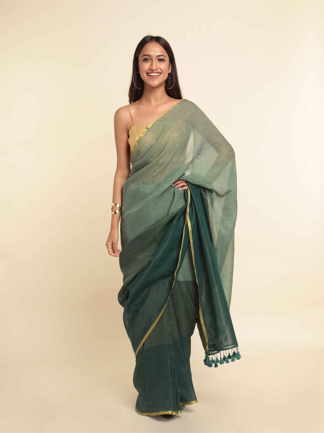 

Suta Green & Gold-Toned Colourblocked Zari Saree