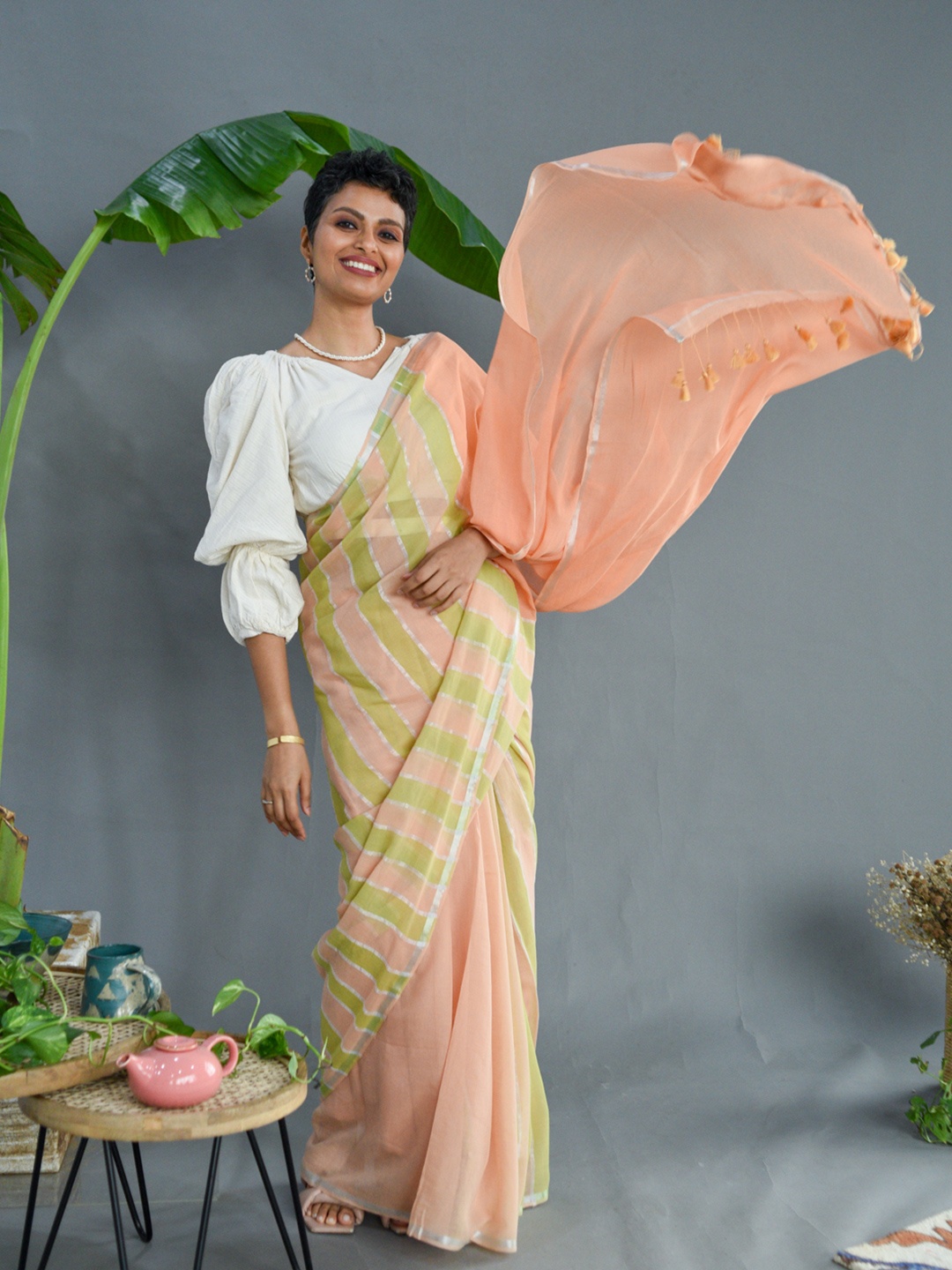 

Suta Peach-Coloured & Green Striped Zari Saree