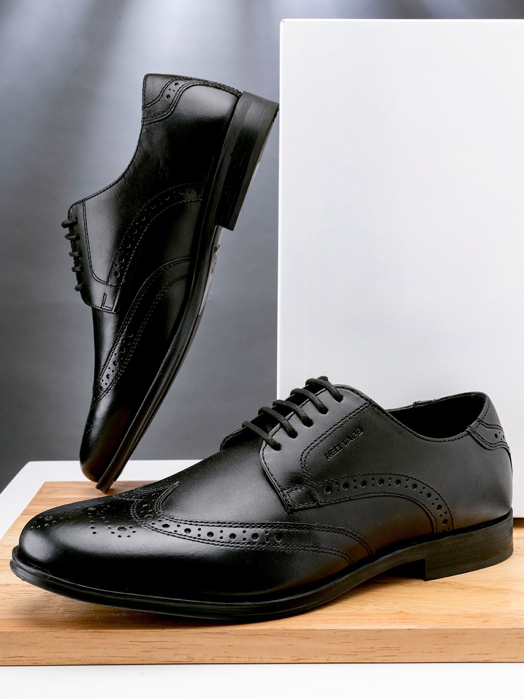 

Red Tape Men Black Solid Leather Formal Brogues