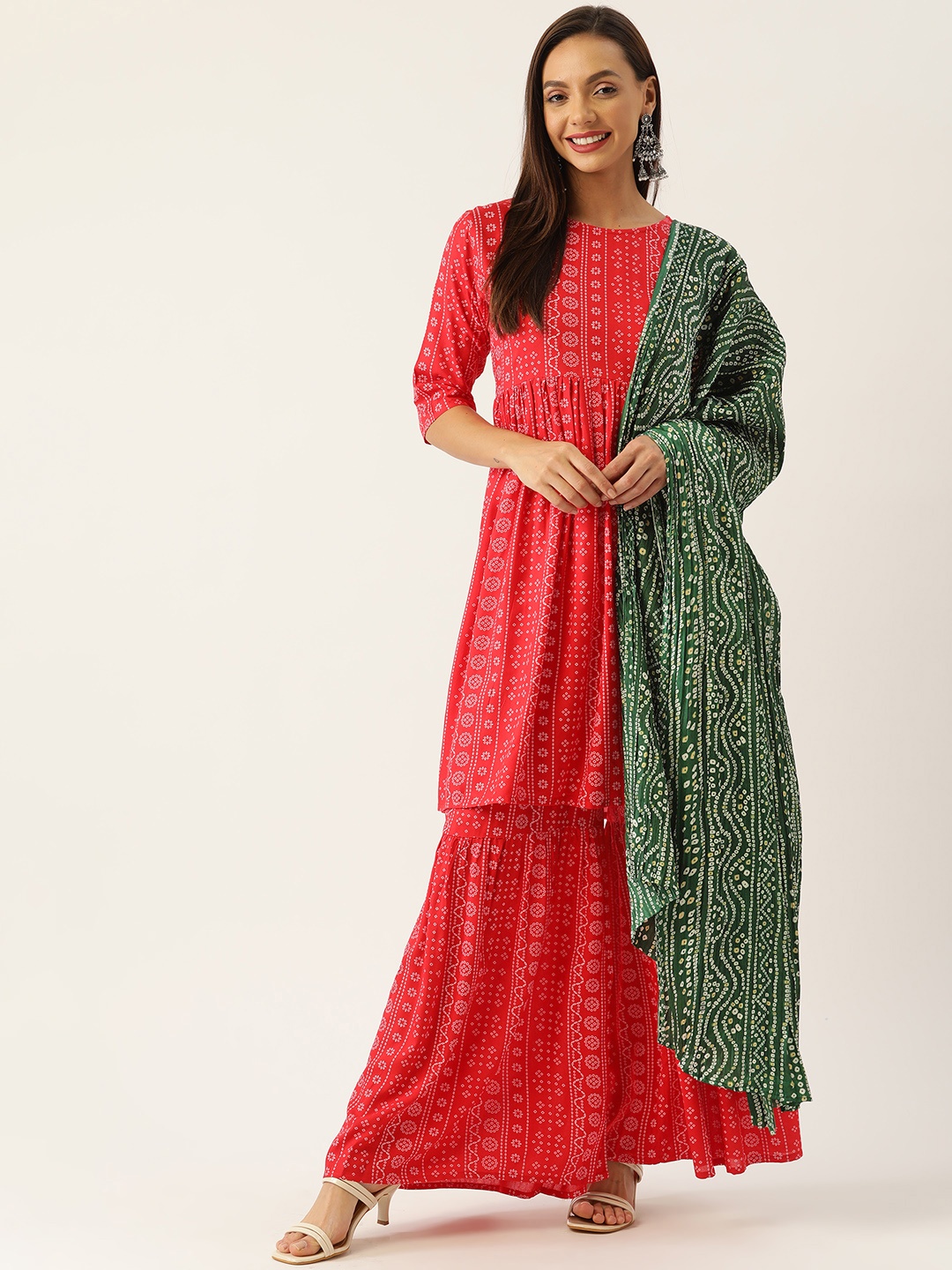 

InWeave Women Red Bandhani Printed Kurta with Sharara & Dupatta