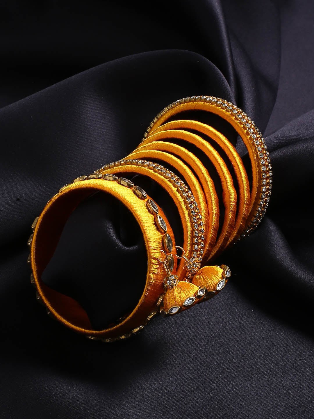 

AKSHARA Women Set Of 14 Gold-Plated & Yellow Handcrafted Bridal Bangle Set