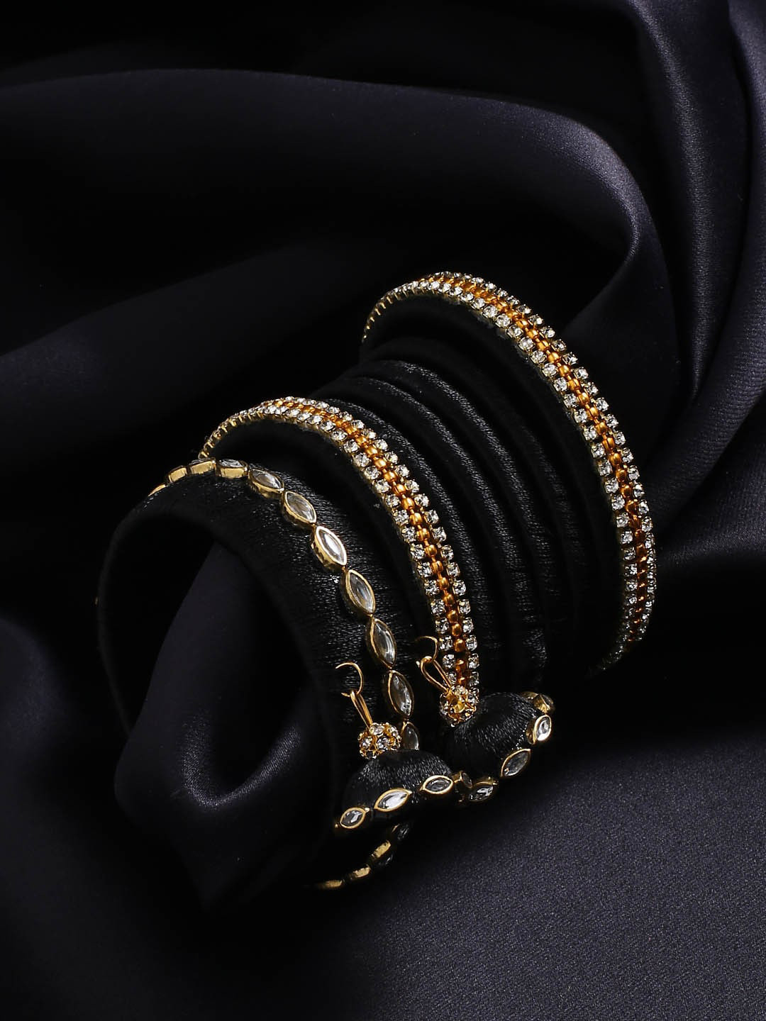 

AKSHARA Set of 14 Gold-Plated Black-Coloured White Stone Studded & Beaded Bangle