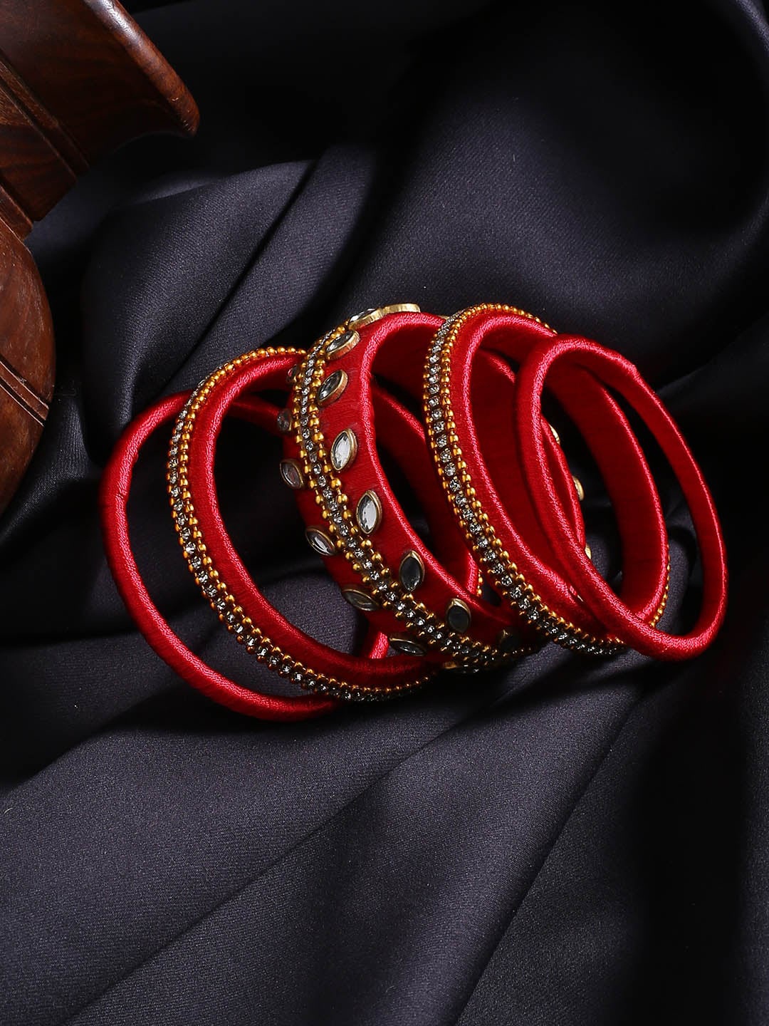 

AKSHARA Set of 10 Red Solid Stone-Studded Silk Bangle