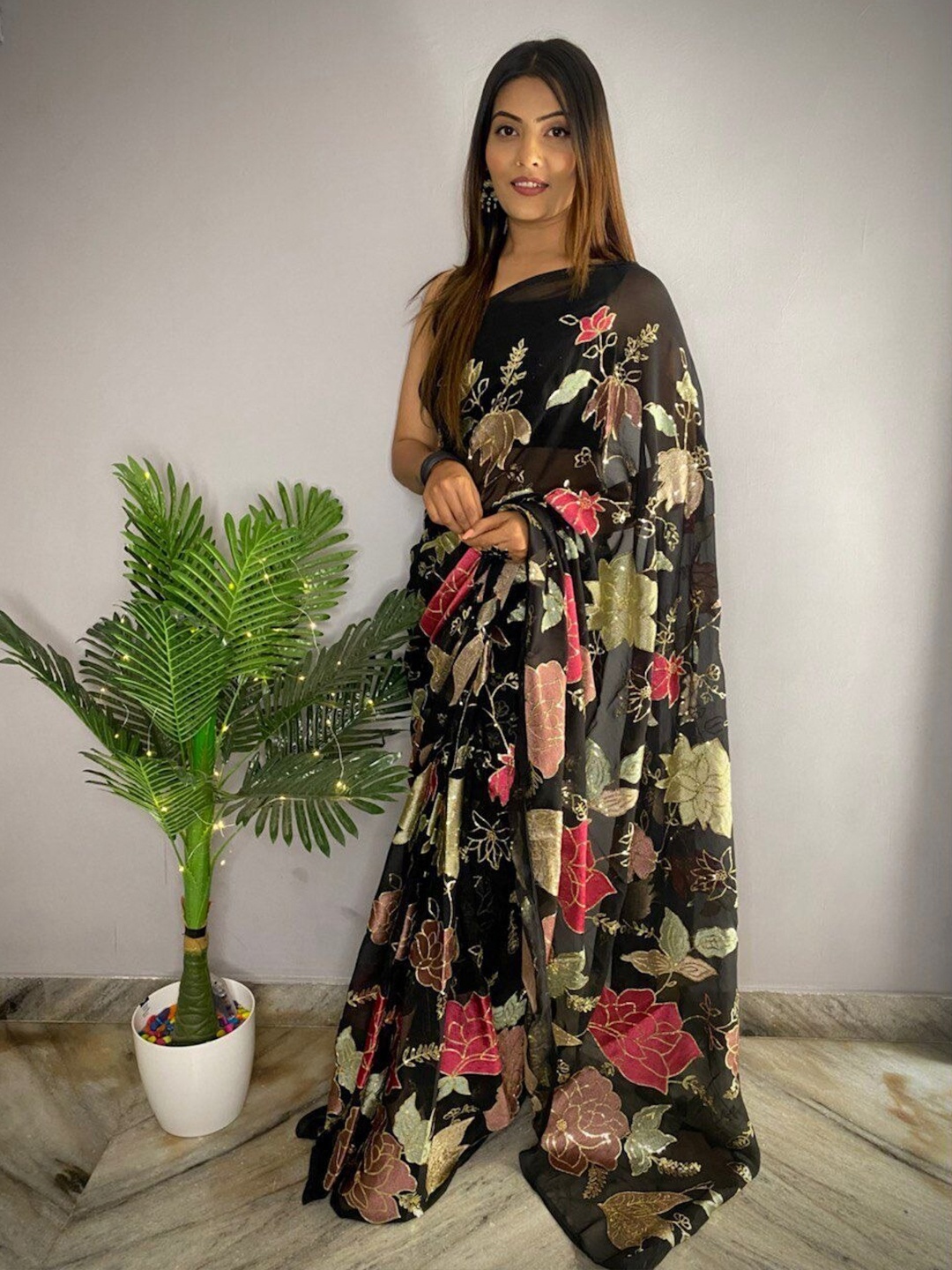 

Sangria Women Black Sarees