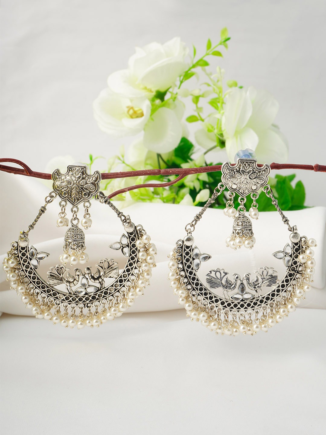 

Urmika Silver-Toned Classic Chandbalis Earrings