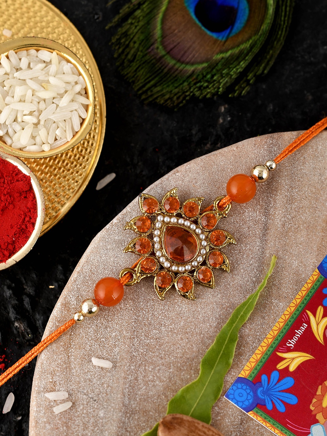 

Shoshaa Men Orange Rakhi With Roli & Chawal