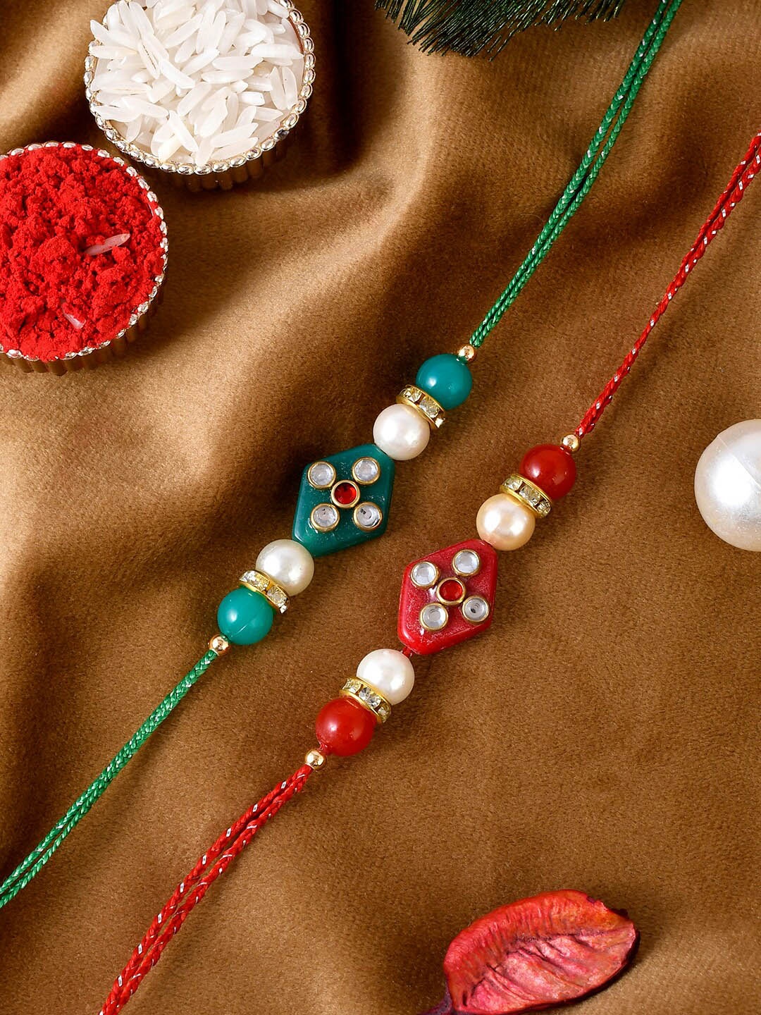 

Shoshaa Men Set Of 2 Red & Green Kundan-Studded Rakhi With Roli Chawal