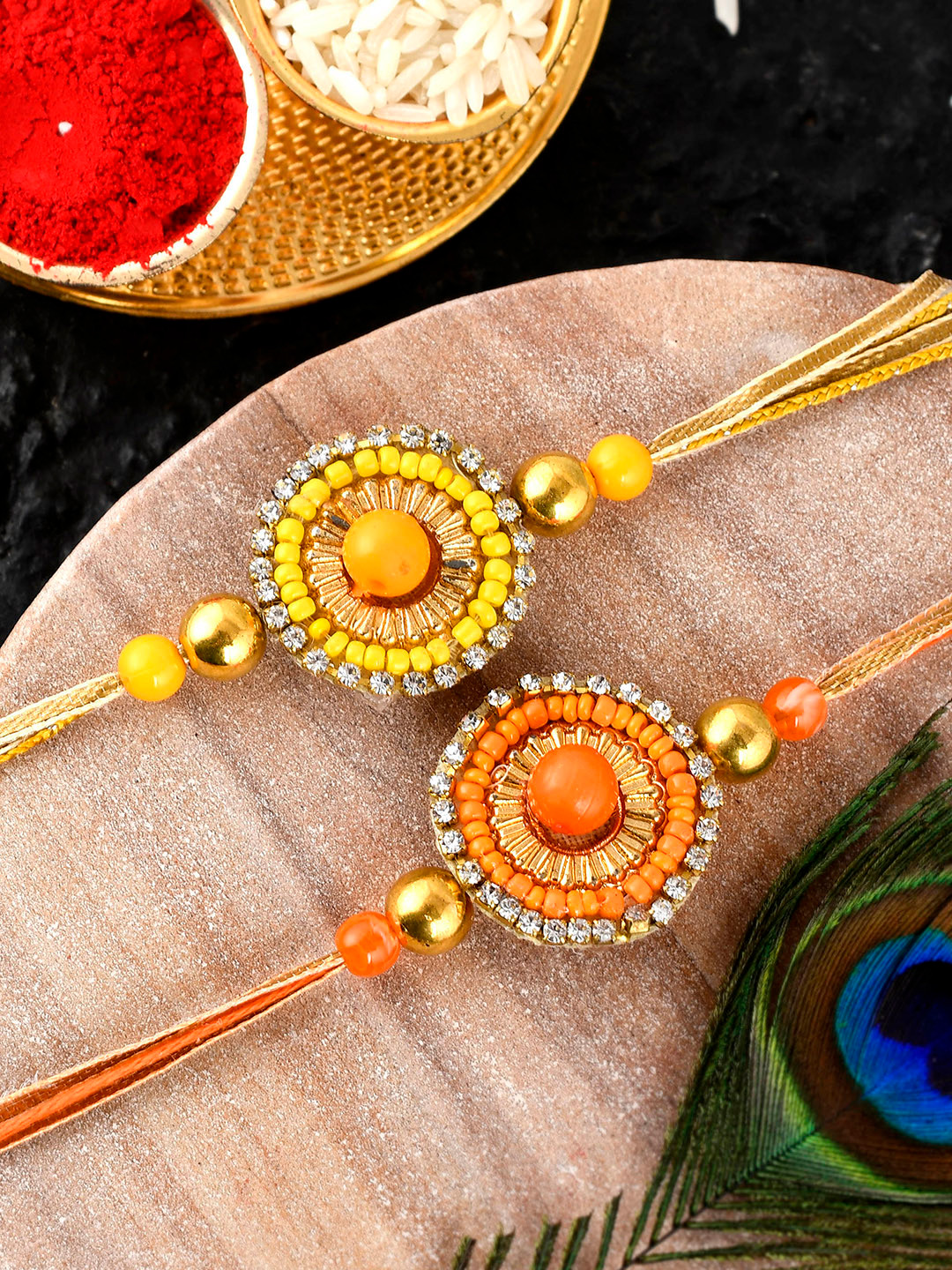 

Shoshaa Set Of 2 Yellow & Orange Beaded Combo Bhai Rakhi With Roli Chawal