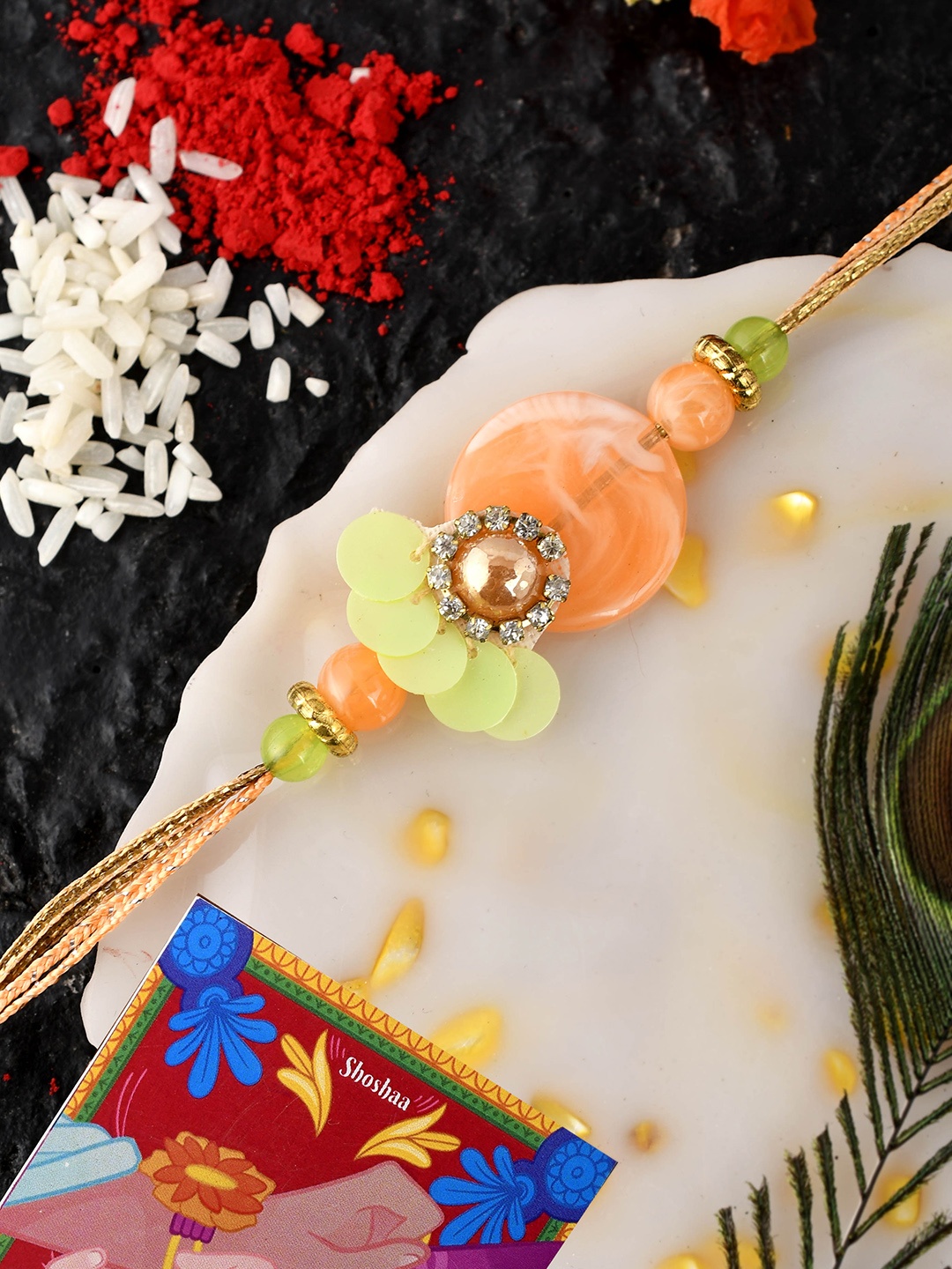 

Shoshaa Men Peach & Green Stone-Studded Rakhi With Roli Chawal